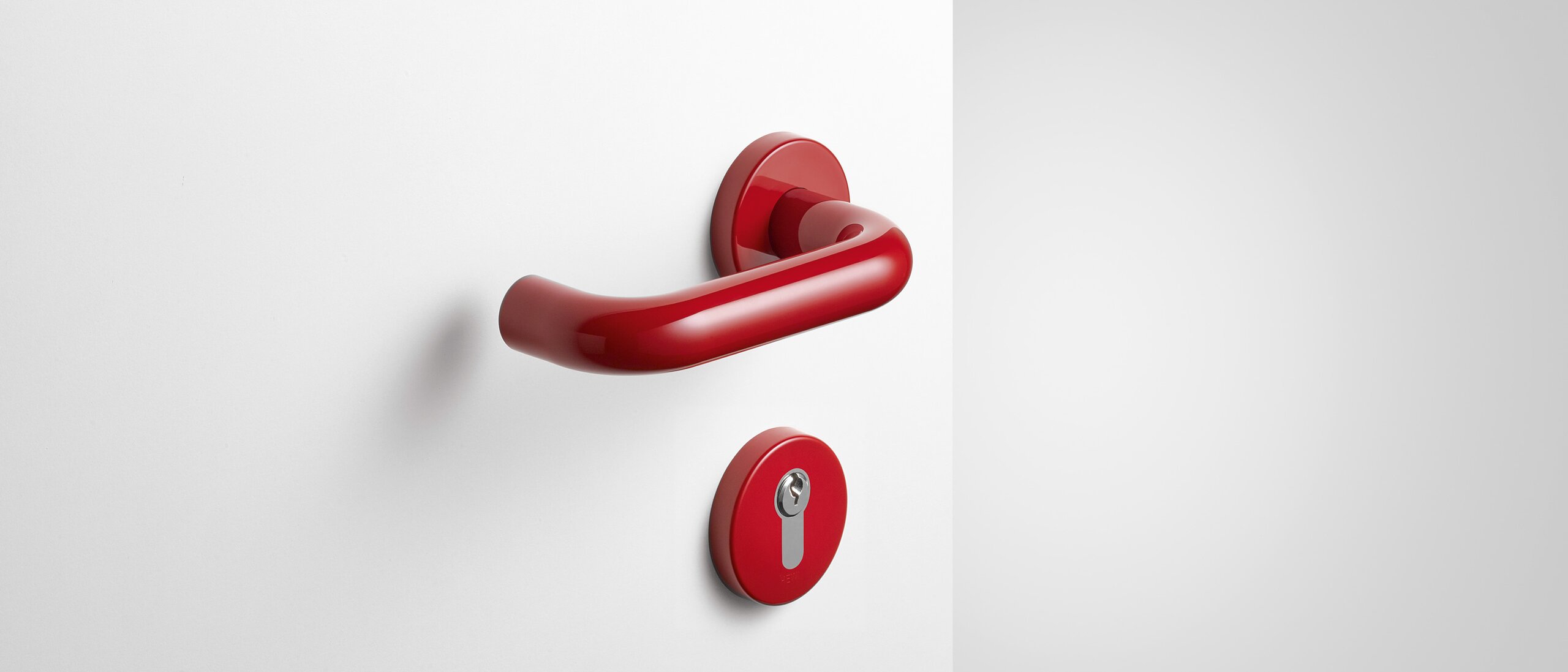 Béquille de porte avec rosace de clé en polyamide de couleur rouge rubis