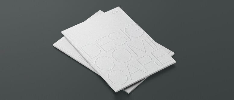 Design Comfort Care Two stacked brochures with the inscription Design Comfort Care
