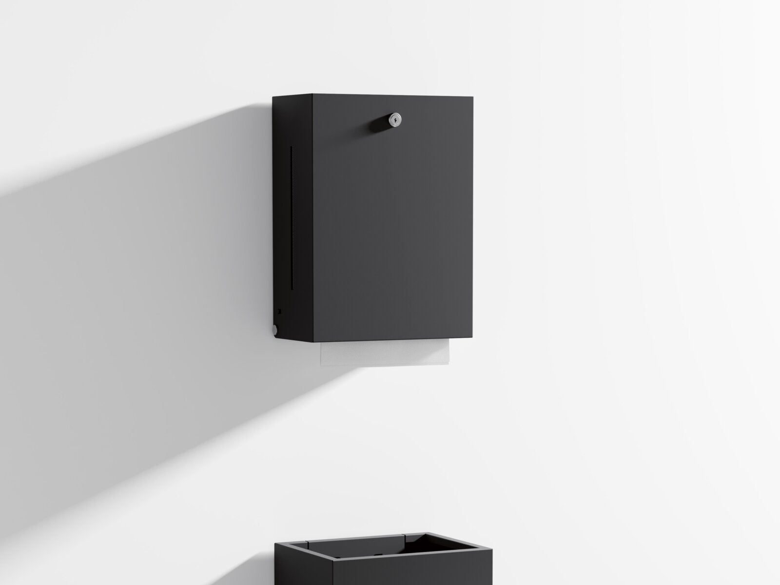 HEWI paper towel dispenser and waste garbage can in matt black Paper towel dispenser and waste garbage can with angular design in matt black stainless steel